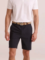 Load image into Gallery viewer, Person wearing navy shorts and a white shirt on a plain background
