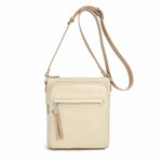 Load image into Gallery viewer, Cream vegan leather crossbody bag with multiple front zippered pockets. 
