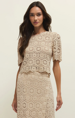 Load image into Gallery viewer, Woman wearing a beige lace top against a plain background
