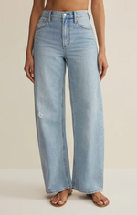 Load image into Gallery viewer, High rise, bowed light denim jeans. 
