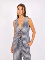 Load image into Gallery viewer, Woman wearing a striped navy and ivory vest with tie front closure 
