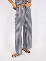 Load image into Gallery viewer, Person wearing a striped navy and ivory outfit with wide-leg pants on a white background
