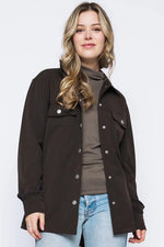 Load image into Gallery viewer, Woman wearing a brown jacket with silver buttons on a white background
