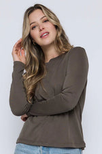 Load image into Gallery viewer, Woman wearing a olive long-sleeve crewneck tee
