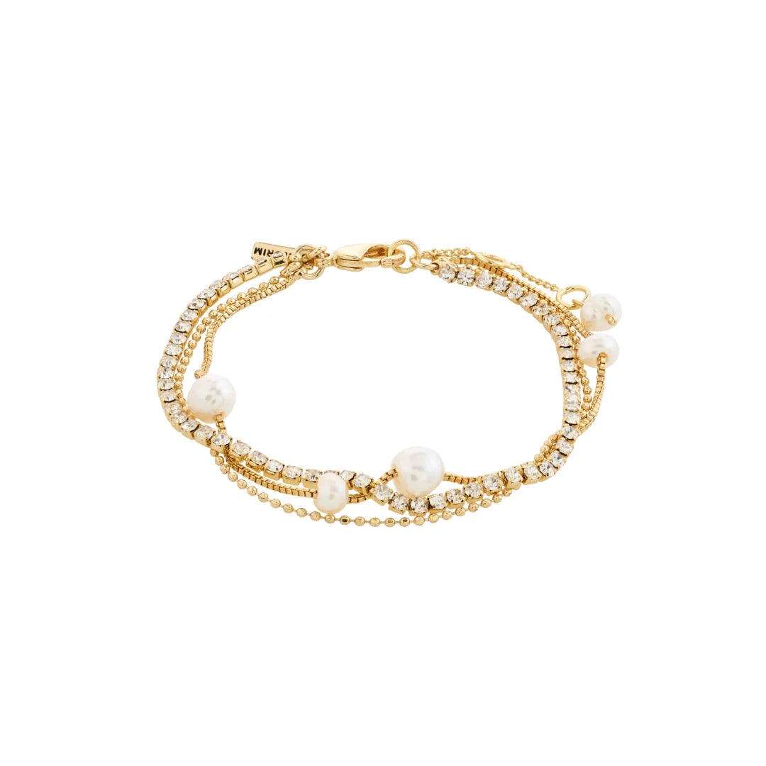 Gold bracelet with pearls and crystals on a white background