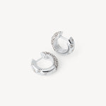 Load image into Gallery viewer, Silver hoop earrings with embedded stones on a white background
