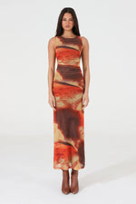 Load image into Gallery viewer, Woman wearing a sleeveless midi dress with abstract pattern on a white background
