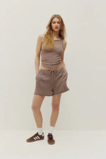 Load image into Gallery viewer, Woman wearing a striped tank top and shorts on a white background

