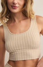 Load image into Gallery viewer, Woman wearing a beige ribbed tank top against a neutral background
