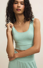 Load image into Gallery viewer, Woman wearing a light green tank bra against a plain background
