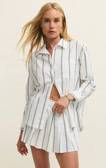 Load image into Gallery viewer, Woman wearing a striped shirt and shorts set on a beige background
