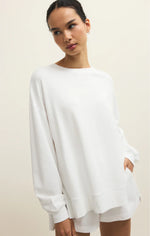 Load image into Gallery viewer, Woman wearing a white oversized sweater on a beige background

