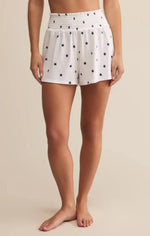 Load image into Gallery viewer, High rise lounge shorts with blue stars on a white background. 
