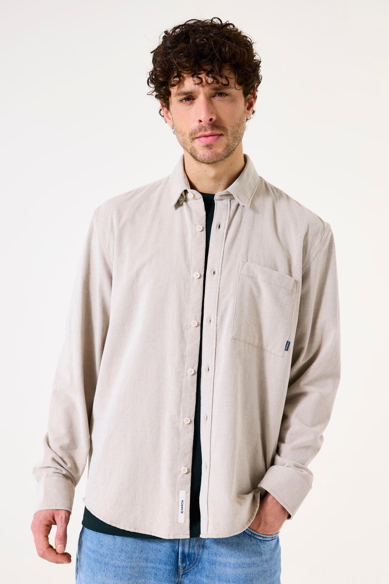 Man wearing a beige corduroy shirt 