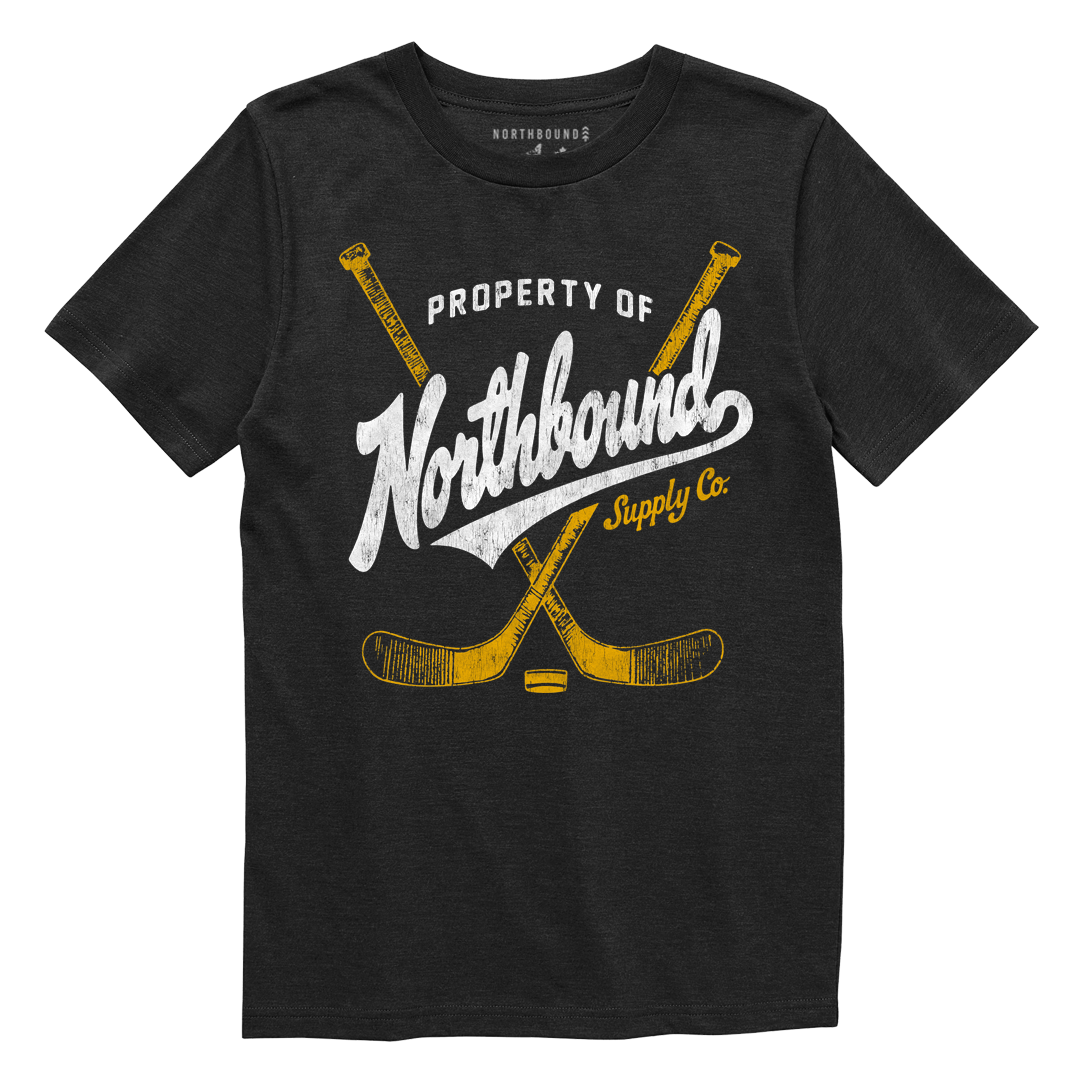 Black t-shirt with 'Property of Northbound Supply Co.' text and hockey stick graphics on a white background
