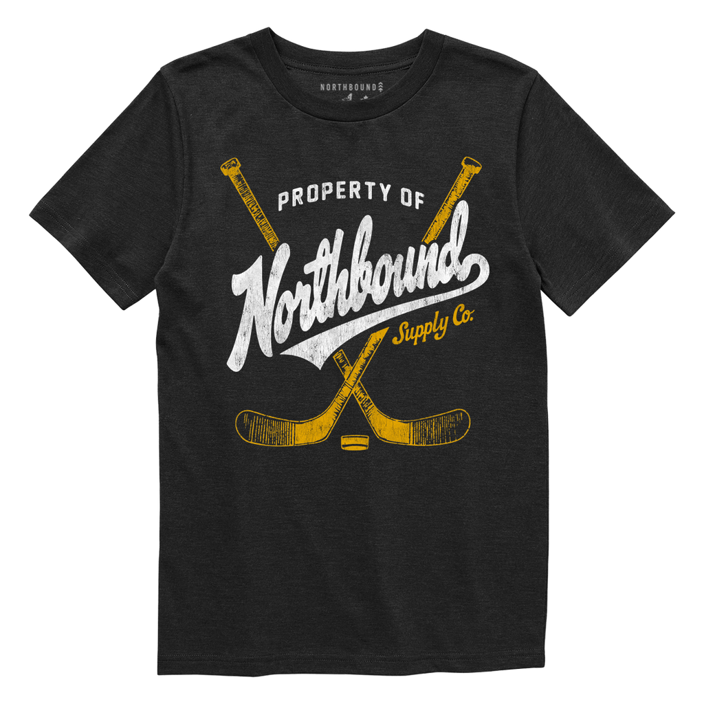 Black t-shirt with 'Property of Northbound Supply Co.' text and hockey stick graphics on a white background