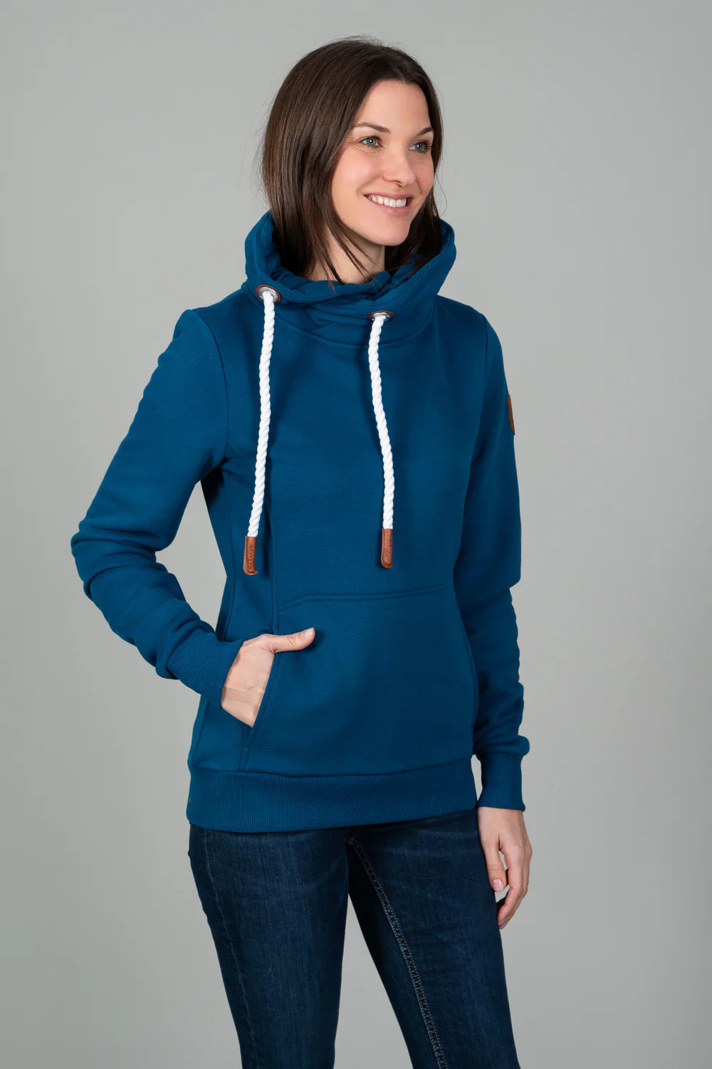 Teal sweatshirt with mock neck and white drawstring.