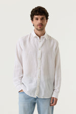 Load image into Gallery viewer, Man wearing a white button-up shirt and light blue jeans against a plain background
